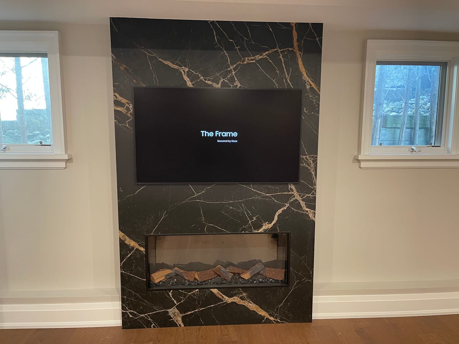 Samsung Frame TV mounted above a fireplace